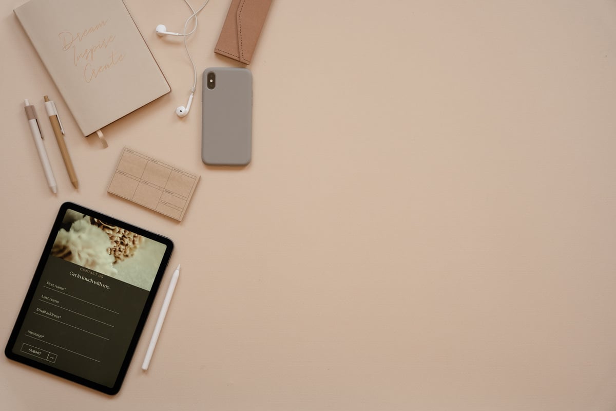 Elegant Office Flatlay of Office Supplies and Gadgets